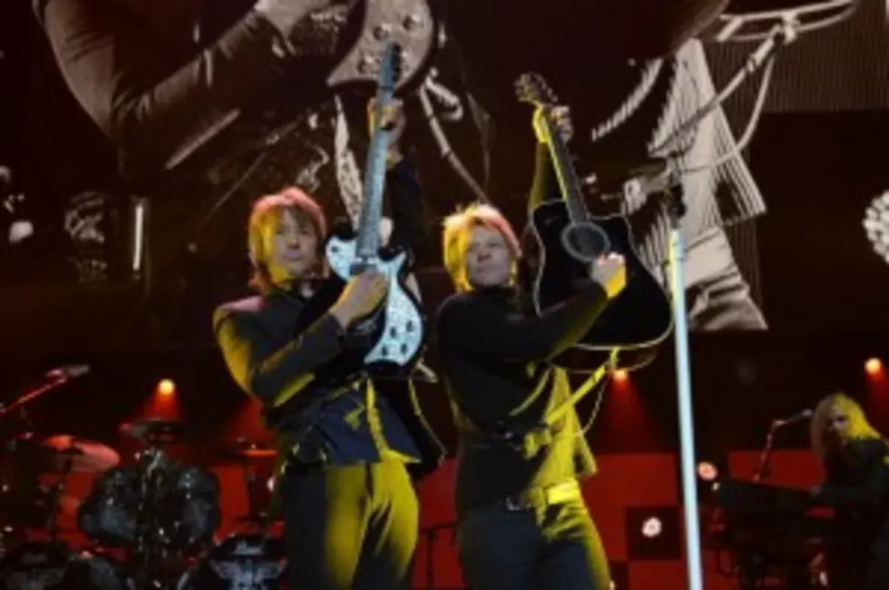 Richie Sambora and Jon Bon Jovi perform at "12-12-12" a concert